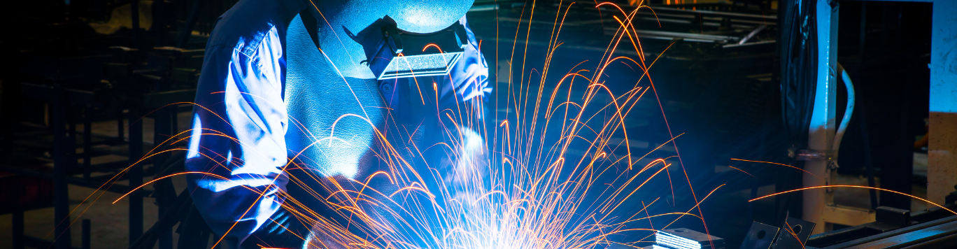 Baker's Gas Stick welding with goggles on