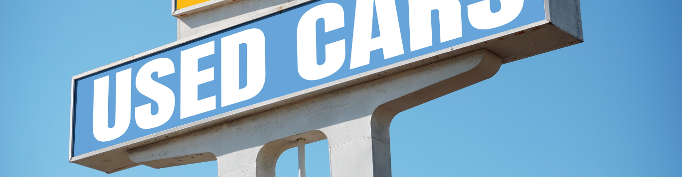 Baker's Gas Used Cars sign