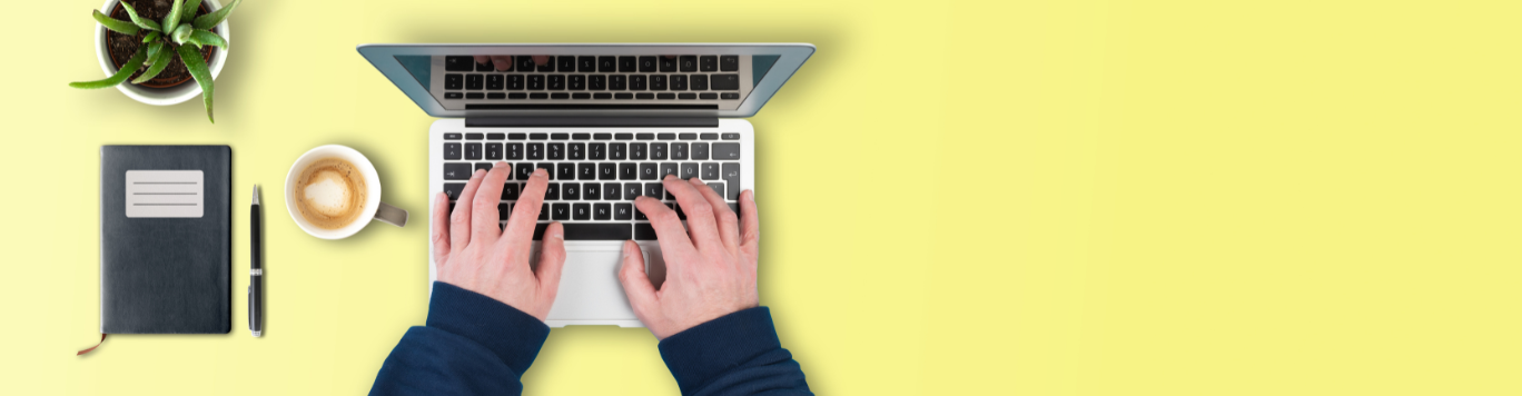 Baker's Gas Person typing on a Macbook