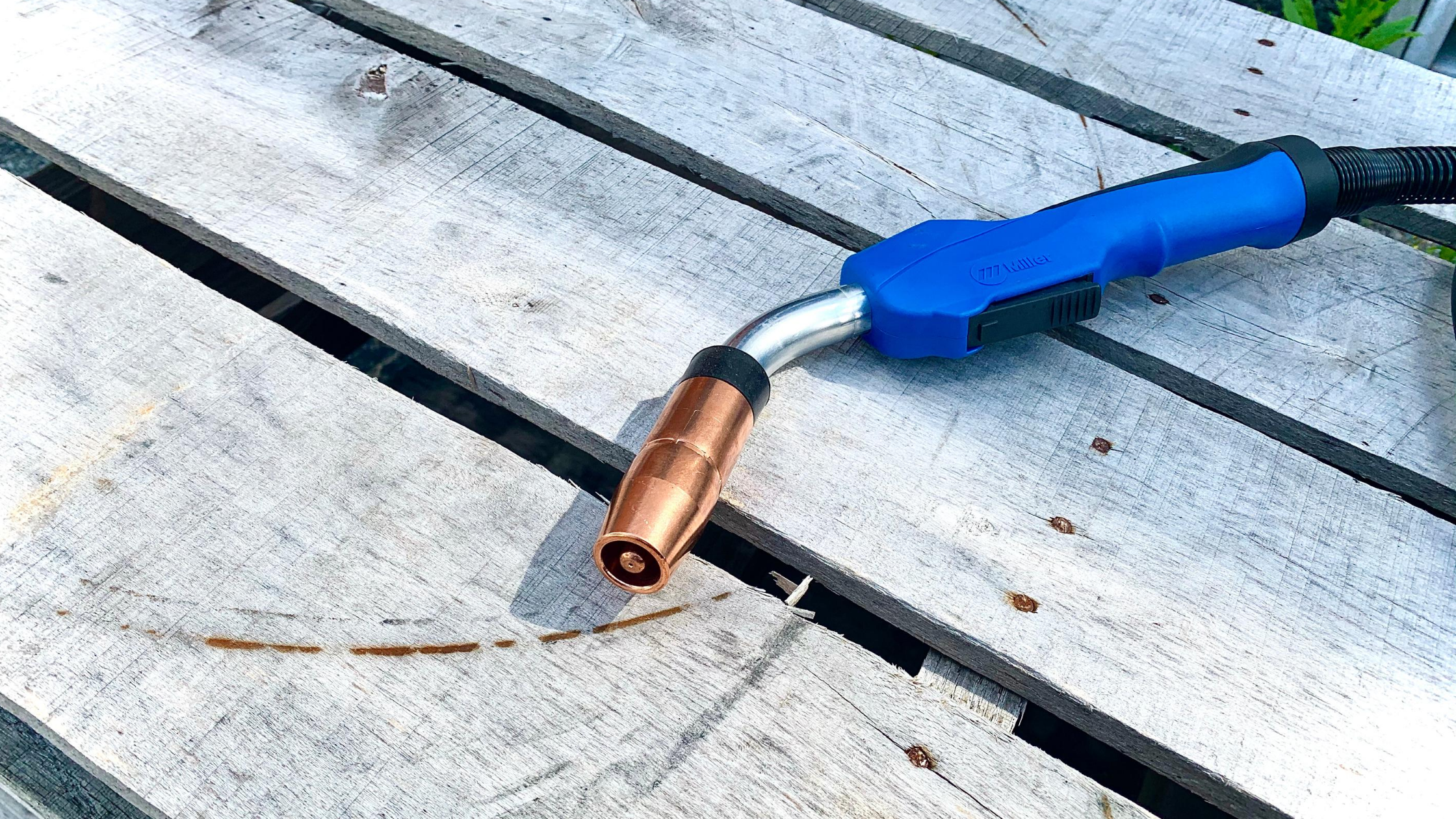 Baker's Gas MDX-250 EZ Select MIG Gun Up Close on a Wooden Pallet