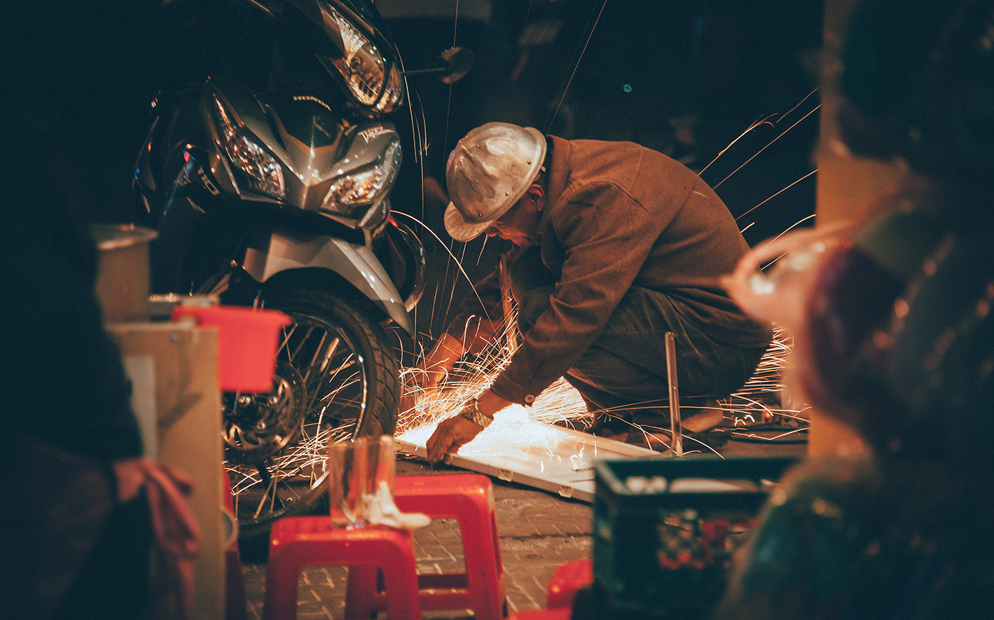Baker's Gas welder working on motorcycle