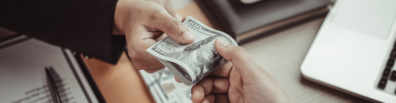 Baker's Gas Person handing another person money