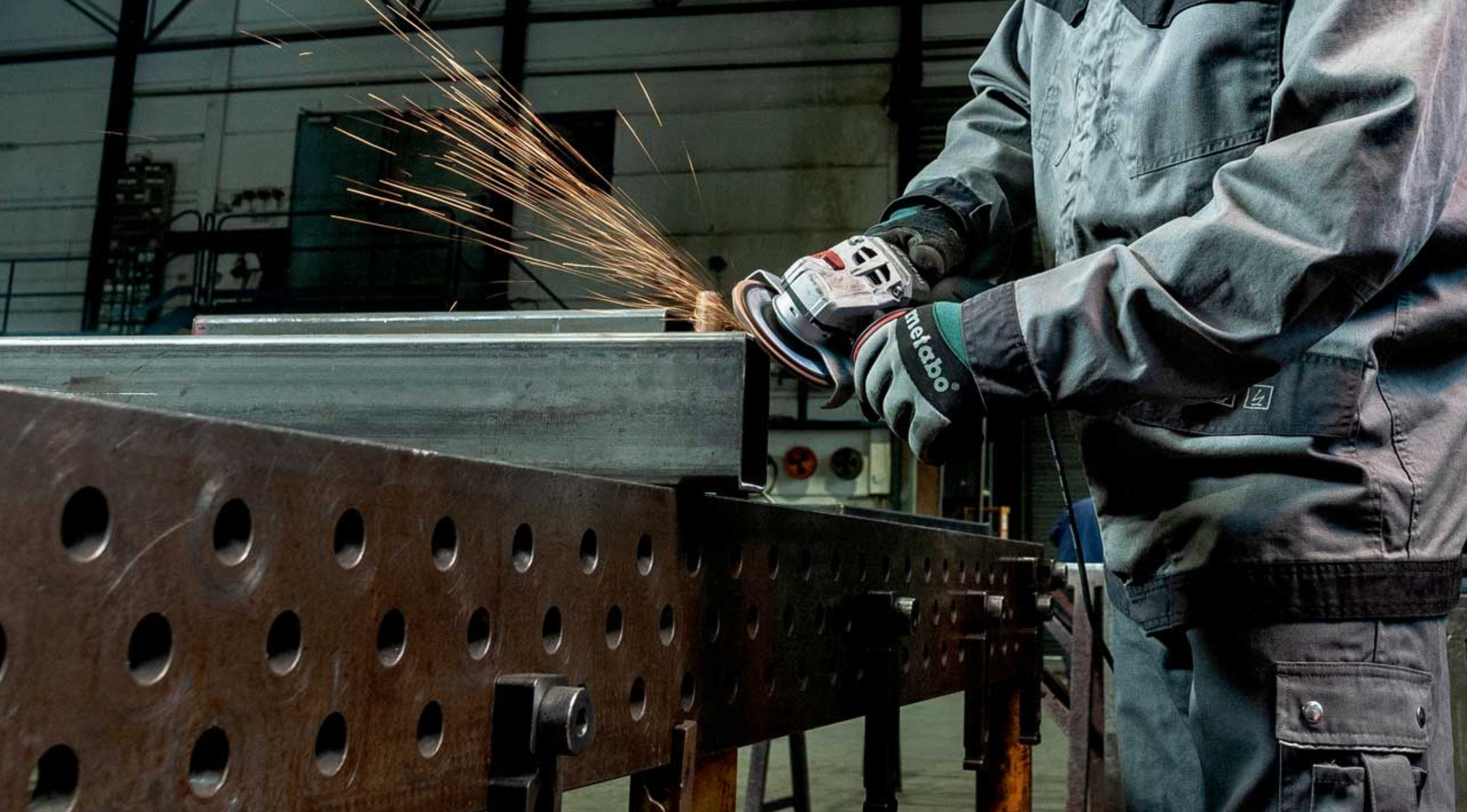 Baker's Gas Worker using metabo grinder wearing metabo gloves
